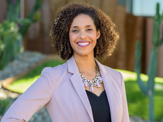 woman smiling on campus