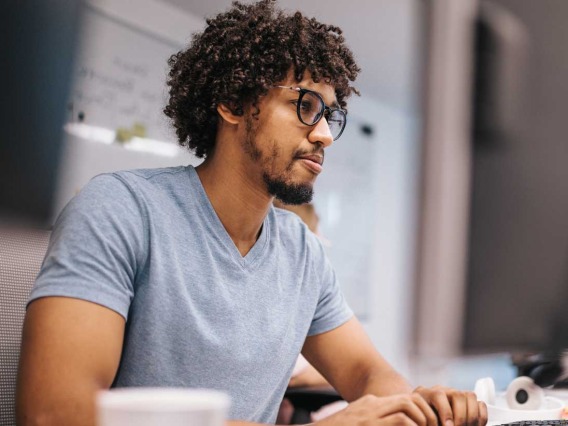 Man typing on computer