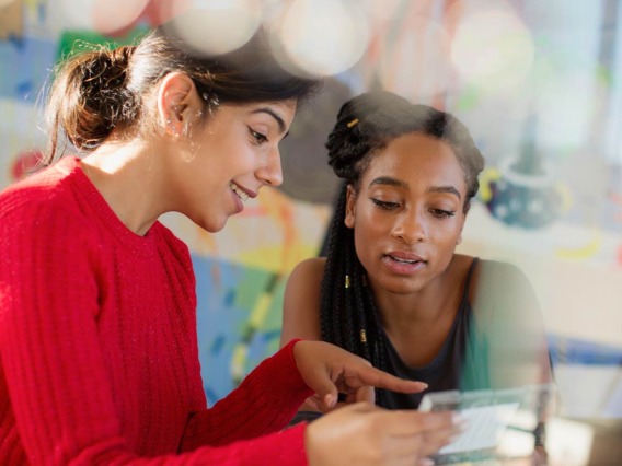 Female students looking tablet