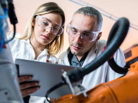 Engineers examining tablet