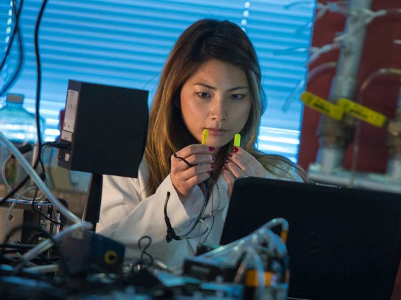 Female Scientist working with cords