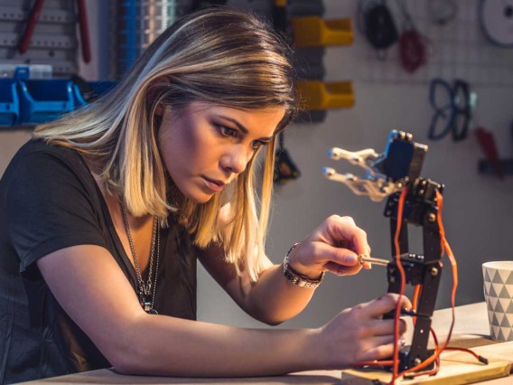 Female engineering student working on robotics