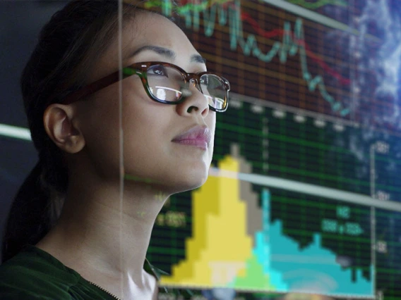 woman reviewing information on a digital screen