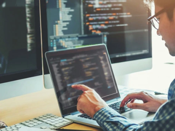 programmer working on laptop
