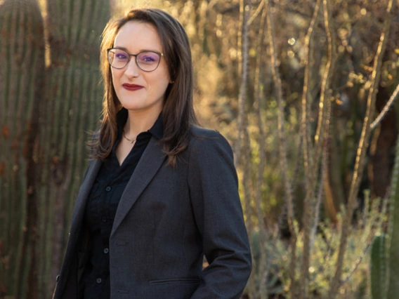 woman standing in front of cactus garden