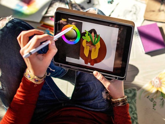 Woman selecting colors on tablet 