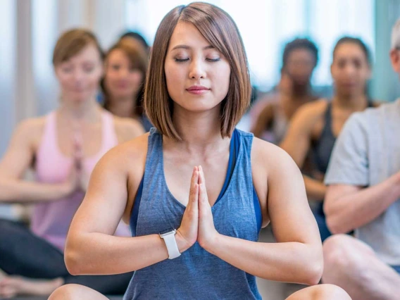 Group of people practicing Yoga