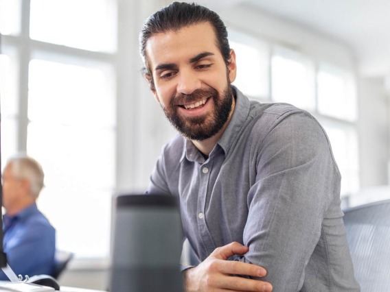 Man using a voice activated speaker