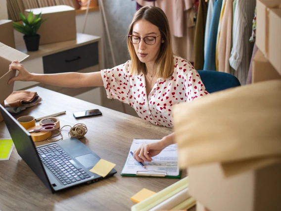 woman working on boxing online orders