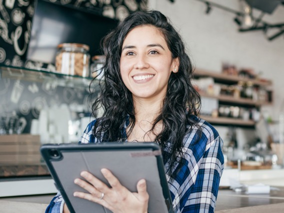 retail manager looking up from her tablet