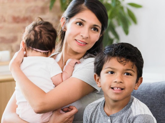 Mom and two children in doctors office 