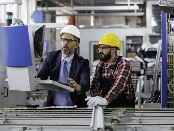 Mechanical engineer and quality inspector working in a labratory.