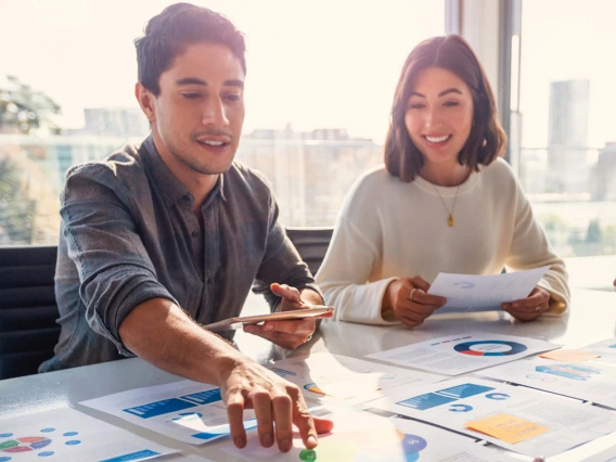 Marketing team reviewing strategy in a conference room.