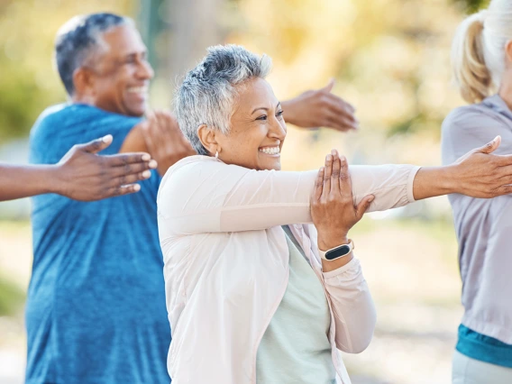 A group of people stretching. 