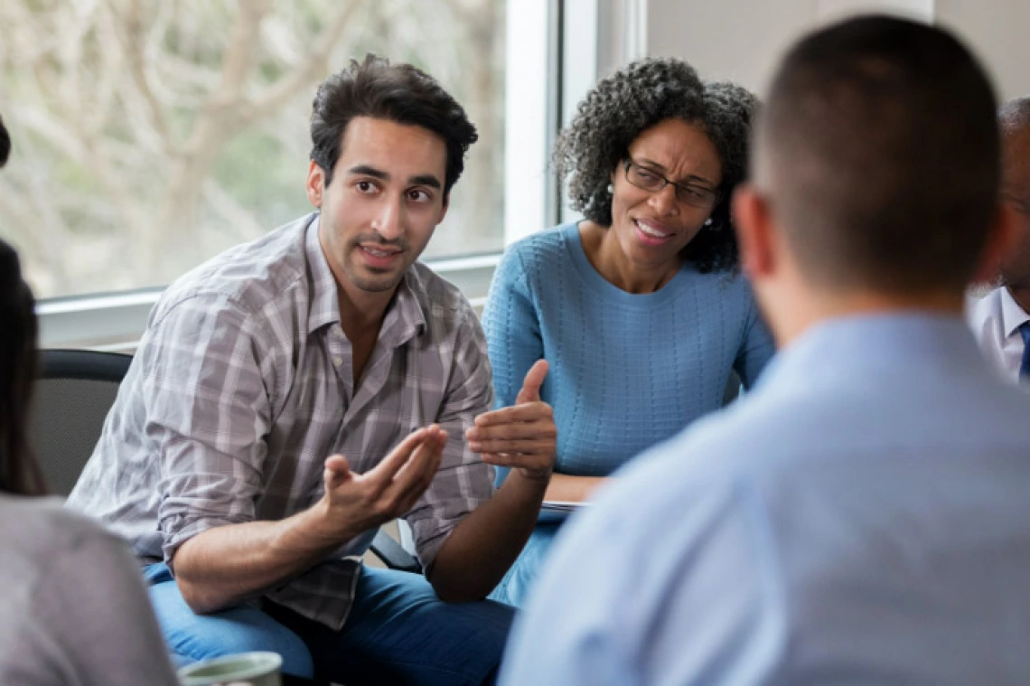 man explaining with his hands