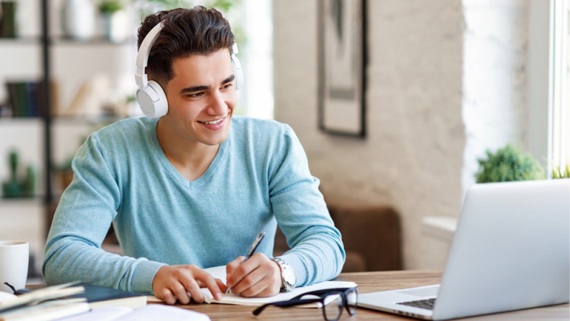 Man studying with headphones on