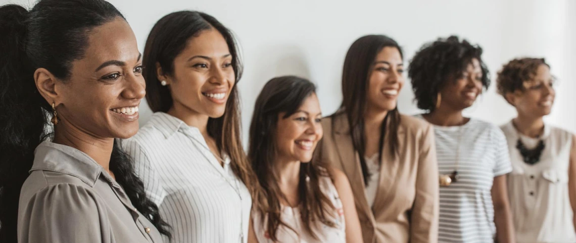 women lined up for a photo