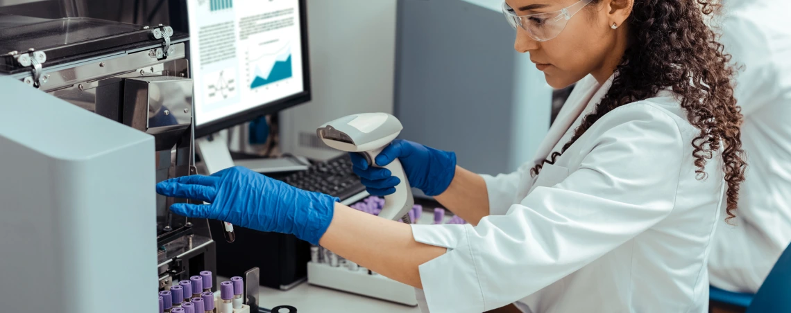 Medical technician working with test tubes