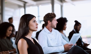 woman focusing in class