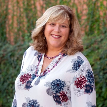 Melody Buckner, Associate Vice Provost for Digital Learning and Online Initiatives smiling headshot