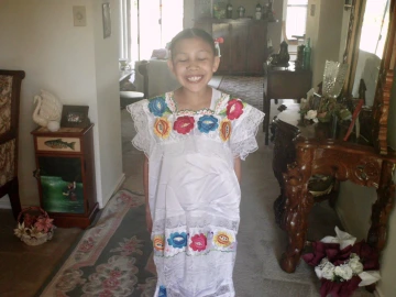 Citlali Gonzalez Trujillo Rios as a child dressed in traditional clothing