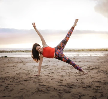 Kellie Kirsch dancing on the beach