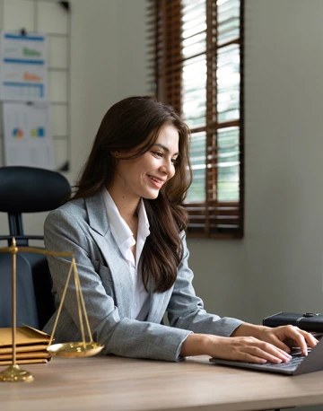 criminal justice professional working on laptop