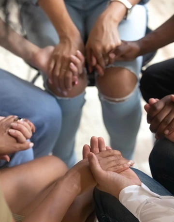 support group holding hands