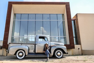 Lori Law in front of a vintage truck