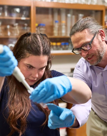 Student and professor working in the Hackett lab