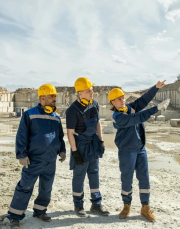 Mine workers discussing safety protocol on a job site