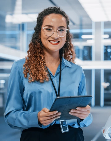 Computer Science engineer standing holding a tablet