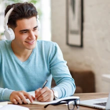 Man studying with headphones on