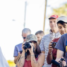 Bilingual journalists interviewing a man on the street in Nogales, Mexico