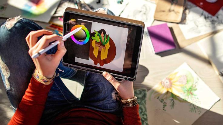 Woman selecting colors on tablet 