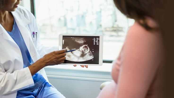 Nurse pointing to ultrasound on iPad