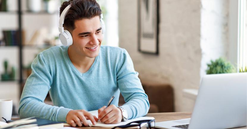 Man studying with headphones on