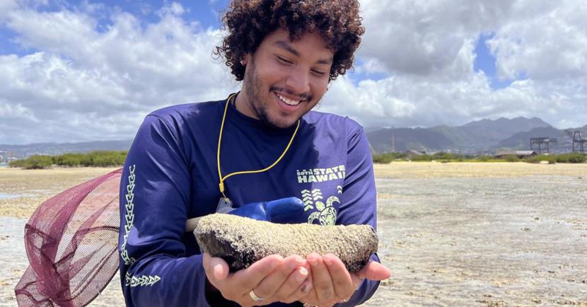 Jhulian Gutierrez examines a desert specimen