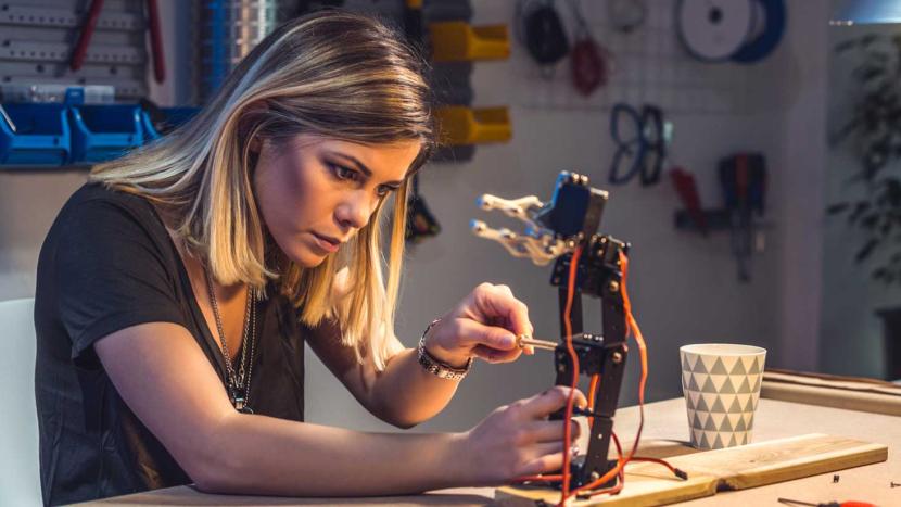 Female engineering student working on robotics